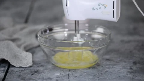Kitchen hand mixer whips a egg white. Stock Footage 151262148