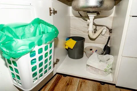 Kitchen Hanging Drawer garbage Trash container bag Can On Cabinet Door house Stock Photos