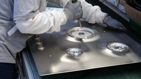 Kitchen hob factory, skilled worker assemble the piece. Filmed in 4K Stock Footage 94422082