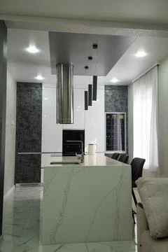Kitchen in the house. Work surface and refrigerator. Stock Photos