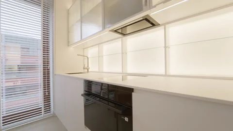 Kitchen household appliance installation inside empty apartment room property. 動画素材 335540962