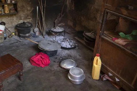 The kitchen inside a hut. African kitchen interior with hearth and stove. Stock Photos
