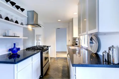 Kitchen interior with black granite tops Stock Photos
