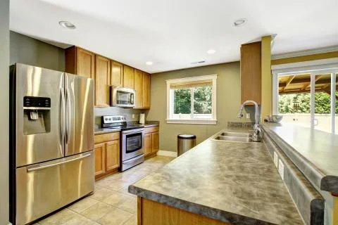 Kitchen interior. granite tops and steel appliances Stock Photos