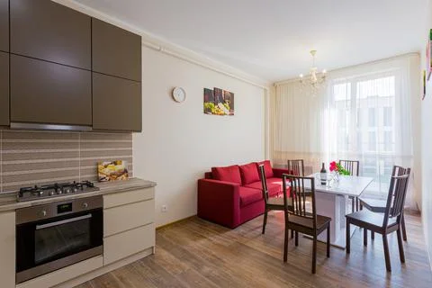 Kitchen interior in gray studio with corridor and stairs Stock Photos