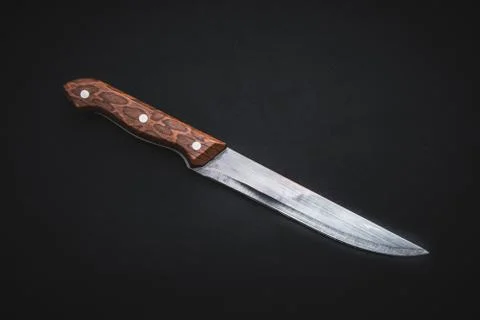 Kitchen knife on black background Stock Photos