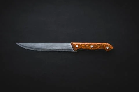 Kitchen knife on black background Фото