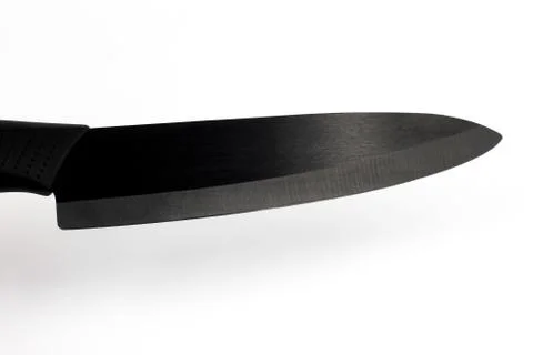 Kitchen knife with black ceramic blade on a white background Stock Photos