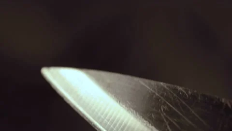 Kitchen knife close up with glossy reflection, slow camera move Stock Footage 170486130