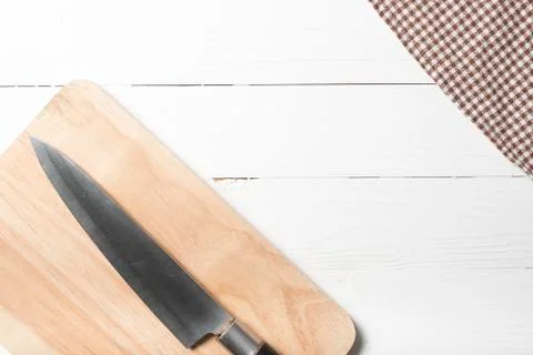Kitchen knife on cutting board Stock Photos