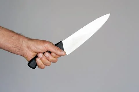 Kitchen knife in a hand Stock Photos