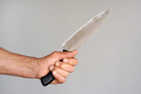 Kitchen knife in a hand Stock Photos