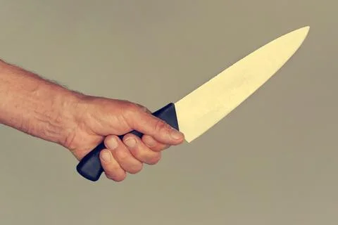 Kitchen knife in a hand Stock Photos