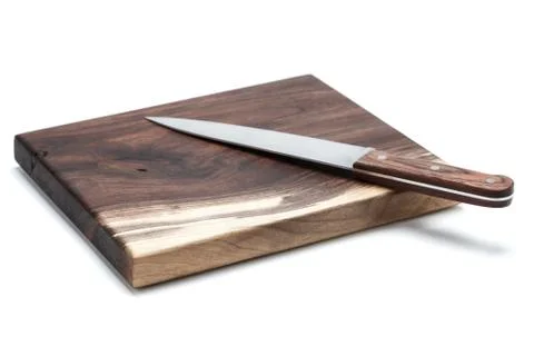 Kitchen Knife Lying On A Cutting Board, White Background Stock Photos