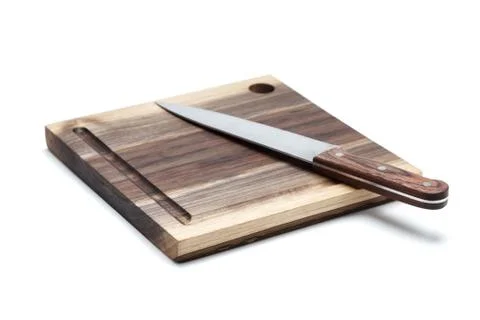 Kitchen Knife Lying On A Cutting Board, White Background Stock Photos