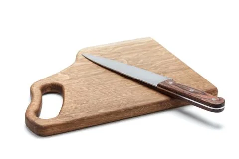 Kitchen Knife Lying On A Cutting Board, White Background 库存照片