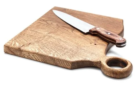 Kitchen Knife Lying On A Cutting Board, White Background Stock Photos