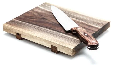 Kitchen Knife Lying On A Cutting Board, White Background Stock Photos