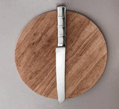 Kitchen knife lying on an old cutting board Stock Photos