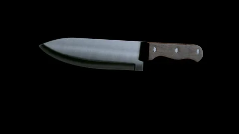 Kitchen Knife Spinning Around and Falling down on Black Background Stock Footage 148489443