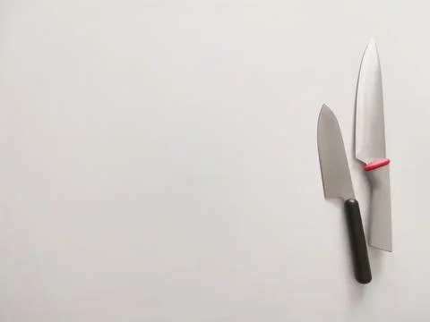 Kitchen knives on a gray table background Stock Photos