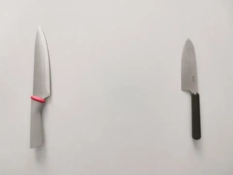 Kitchen knives on a gray table background Stock Photos