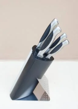 Kitchen knives set in the plastic block Stock Photos