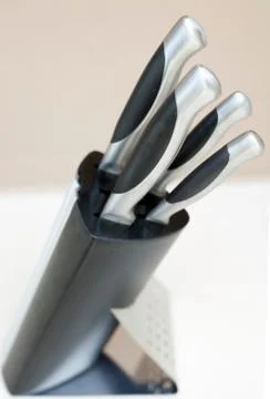 Kitchen knives set in the plastic block Stock Photos