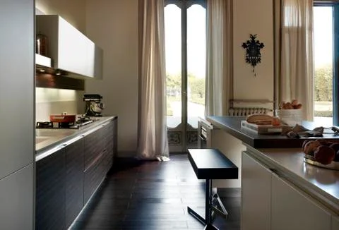 Kitchen with large windows at daylight Stock Photos