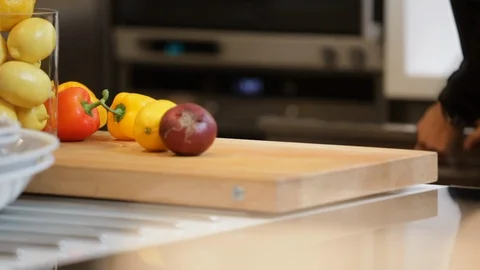 Kitchen with man preparing dinner. Stock Footage 106077542