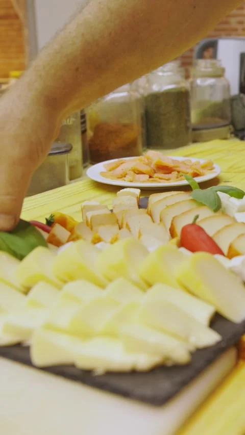 Kitchen - man stand near table with food and making snacks Stock Footage 330554988