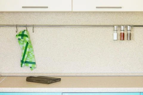 Kitchen marble table with cutting board and various spices. Stock Photos