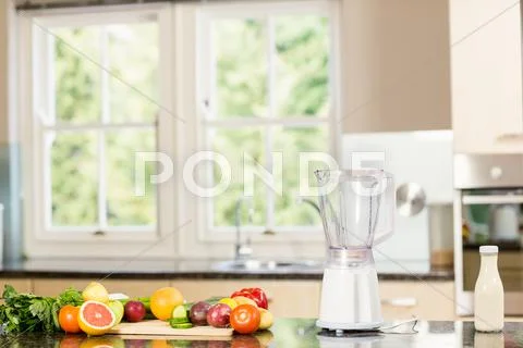 Kitchen With Mixer And Fruit On Counter