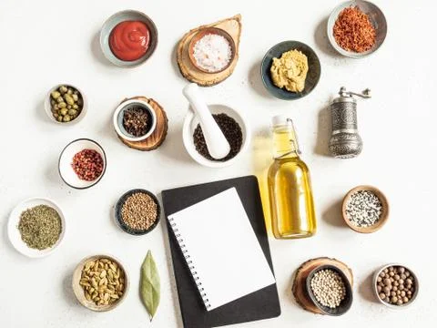 Kitchen notepad mockup for culinary text, various dry spices and sauces on a  Stock Photos