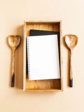 Kitchen notepad or cookbook mock up for culinary text on wood tray and wood s Stock Photos