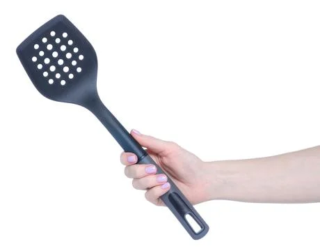 Kitchen plastic spatula in hand Stock Photos