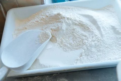 Kitchen, plastic transparent box with flour. Ingredient for cooking Foto stock