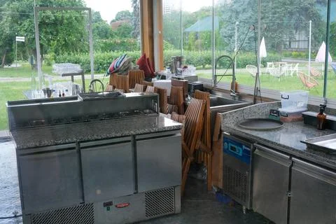 Kitchen prep area with a vibrant park view Stock Photos