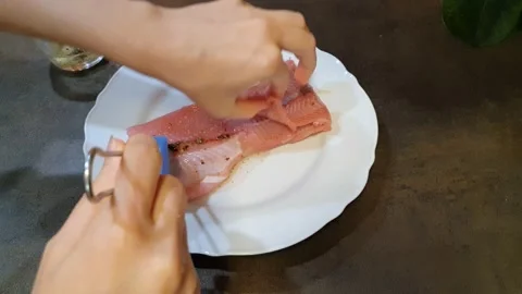 Kitchen. Preparing a fresh fish. Stock Footage 158613083