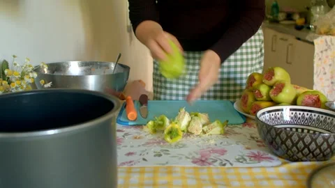 Kitchen preserve preparation, preparing quince for preserving Stock Footage 320955859