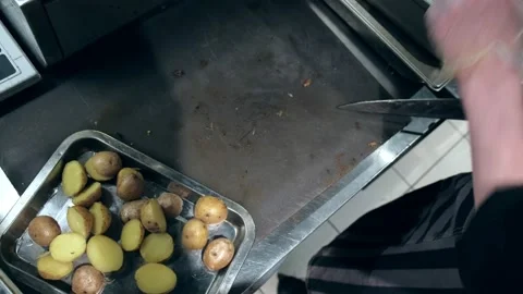 Kitchen. Restaurant. Cook cuts potatoes. Boiled potatoes. Close ap. Stock Footage 171683160
