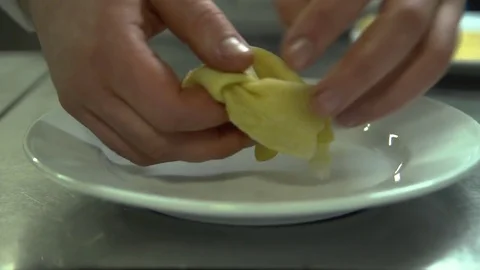 Kitchen. Restaurant. Cooking. The chef puts the pancakes on a plate and Stock Footage 73955146