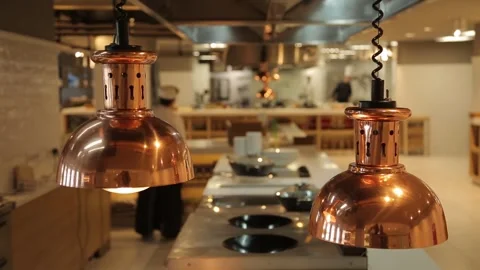 Kitchen, restaurant, serving table, cooks, loft, bronze lamps, food, dishes Stock Footage 303406363