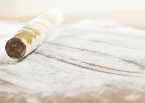 Kitchen rolling pin on flour. Background. To cook Stock Photos