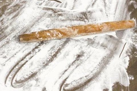 Kitchen rolling pin on flour. Background. To cook Stock Photos