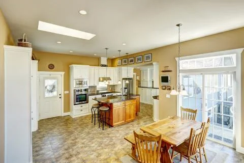 Kitchen room with rustic dining table set Stock Photos