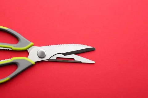 Kitchen scissors on color background, top view. Space for text Stock Photos