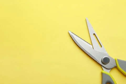 Kitchen scissors on color background, top view. Space for text Stock Photos