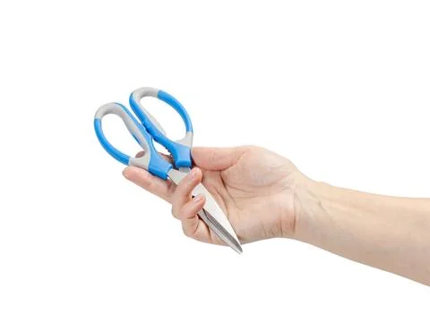 Kitchen scissors on the woman's palm with the white background. Stock Photos