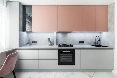 Kitchen set of peach and gray color Stock Photos